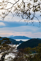 tranquil seascape of sea and islands during sunset