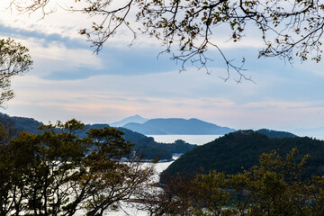 tranquil seascape of sea and islands during sunset