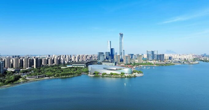 Aerial shot of modern city commercial buildings skyline and lake in Suzhou, China