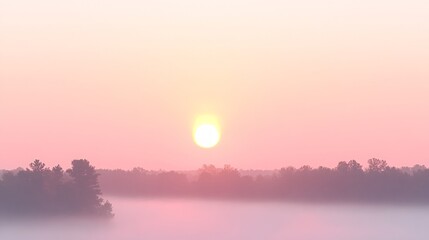 Fototapeta premium Serene Pink Sunrise Over Misty Forest Landscape