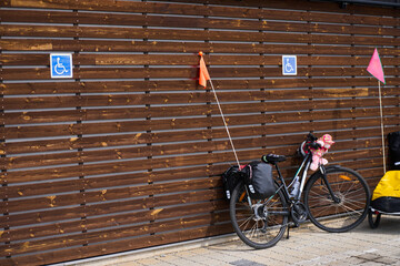 A public bicycle parking area situated near essential community spaces like schools, supermarkets, or offices. The spot promotes cycling as a practical, eco-friendly transport choice