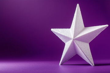 Obraz premium A New Year's decoration featuring a star on a purple background.
