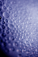 Close Up of Condensation Floating Liquid Water Bubbles and Drips on Glass from Rain