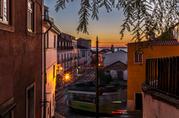 A long exposure with light trails of a cable car in Lisbon at sunrise