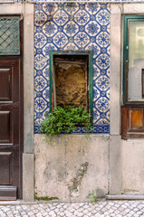 The narrow alleys and old buildings of the Alfama neighborhood in Lisbon in the late afternoon