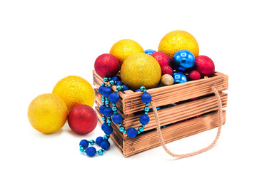 Wooden vintage box with shiny Christmas tree decorations, balls and garlands isolated on a white background. Winter holidays. New Year.	