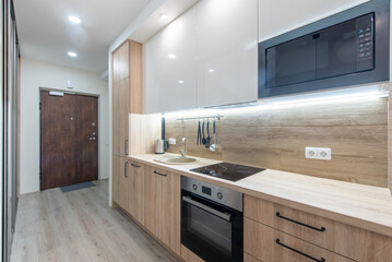 Modern Minimalist Home Kitchen Interior With Wooden Fixtures and Contemporary Appliances
