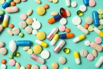Various pills on a colored background