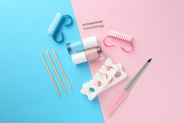 Set of pedicure tools on color background, flat lay