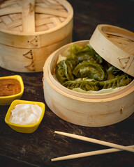 steamed dumplings in bamboo steamer.