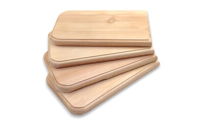 Photo of a stack of wooden chopping boards, isolated on white background.