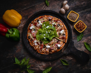 fresh pizza with basil and feta cheese