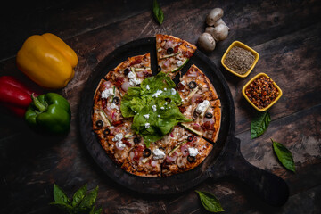 fresh pizza with basil and feta cheese