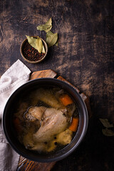Chicken broth soup or bouillon in pan