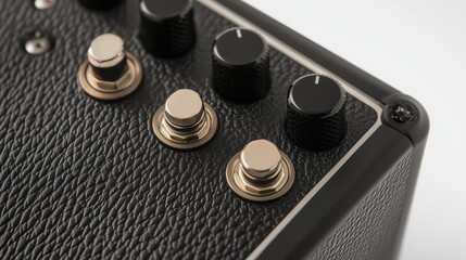 Close-up of guitar amplifier controls and switches