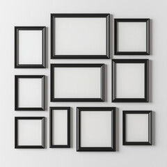 Photorealistic Collage of Black Frames with Blank White Inserts on White Wall