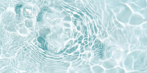Obraz premium Ripples in clear blue water with abstract circular patterns, suitable as calming SPA background