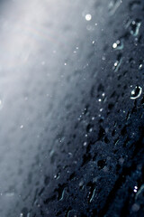 Close Up of Heavy Rain Floating Liquid Water Bubbles and Drips Black Background