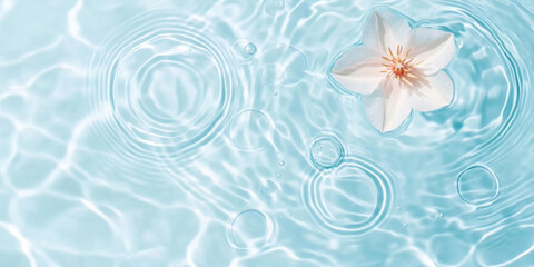 Pink flowers floating on water surface with ripples, perfect for SPA background