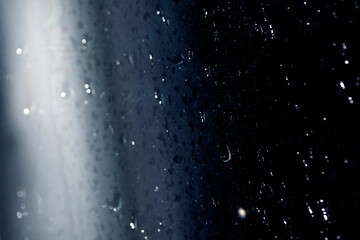 Close Up of Heavy Rain Floating Liquid Water Bubbles and Drips Black Background