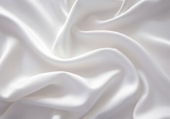 Naklejka premium Flowing white silk fabric with elegant folds and soft texture