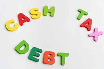 Naklejka premium cash, tax, debt, financial and business terms concept alphabet colorful text on white background