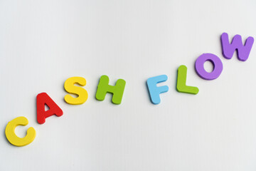 cash flow word in random ascending flowing shape concept alphabet colorful text on white background