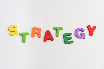 strategy single word in random placement playful concept alphabet colorful text on white background