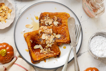 Pumpkin French Toast with Maple Syrup, Almonds and Powdered Sugar