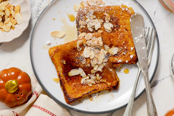 Pumpkin French Toast with Maple Syrup, Almonds and Powdered Sugar