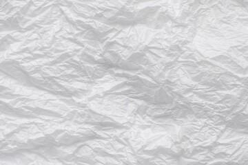 White crumpled paper background.