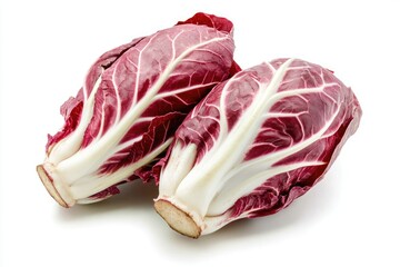 Fototapeta premium A pair of red and white radicchio heads, isolated on a white backdrop
