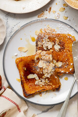 Pumpkin French Toast with Maple Syrup, Almonds and Powdered Sugar