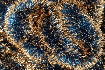 Beautiful shiny tinsel as background, closeup view