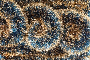 Beautiful shiny tinsel as background, closeup view