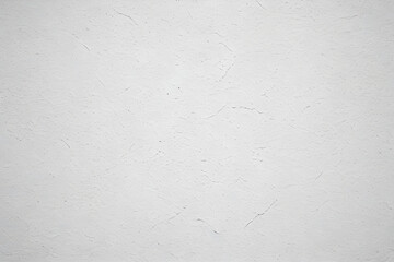 Fototapeta premium Textured white wall with subtle cracks