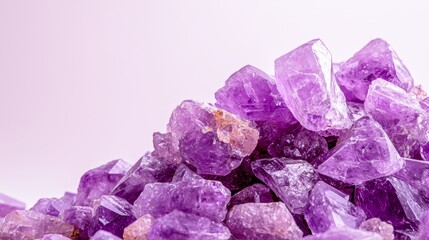 Fototapeta premium A pile of purple crystals on a white background