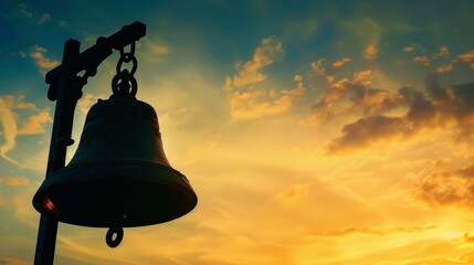 Silhouette of a church bell ringing out the call to worship and praise