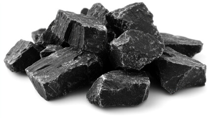 Fototapeta premium Pile of dark grey, rough-hewn stones on white background.