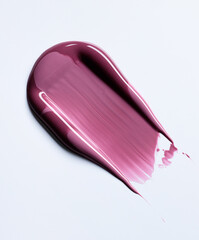 A burgundy maroon shade of lipgloss, lipstick smear, cosmetics beauty product texture, liquid blush, lipgloss swatch