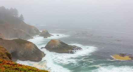 Obraz premium Rocky coastline with fog, waves crashing against cliffs