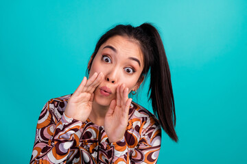 Photo portrait of lovely young lady amazed share news cover mouth dressed stylish colorful clothes isolated on cyan color background