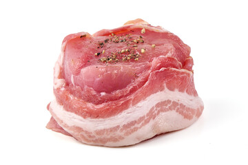 Raw meat medallions wrapped in bacon seasoned with spices, isolated on white background.