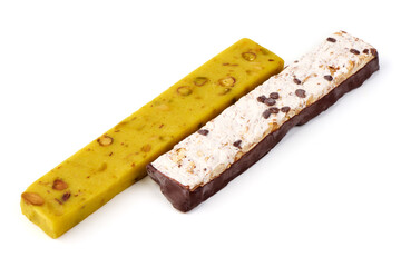 Assorted nougat bars with hazelnuts and chocolate, isolated on white background.