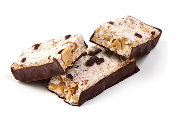 Chocolate chip nougat bar with dark chocolate coating, isolated on white background.