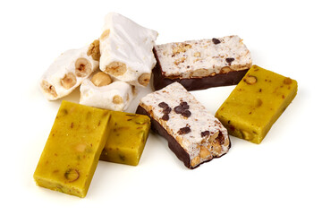 Three assorted nougat bars with hazelnuts and chocolate, isolated on white background.