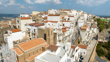 Aerial view of white houses, buildings and apartments of Pisticci, in the province of Matera, Basilicata. It is a small hill town in southern Italy.