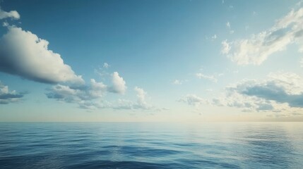 Obraz premium Calm ocean, blue sky, fluffy clouds.
