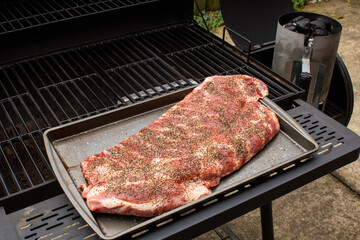 Pork spare ribs cooked and smoked on the barbeque
