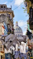 hanging clothes on the street in havana 